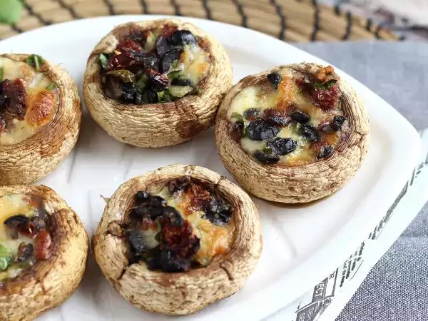 Рецепт Фаршированные шампиньоны в духовке — вкусная закуска для аперитива
